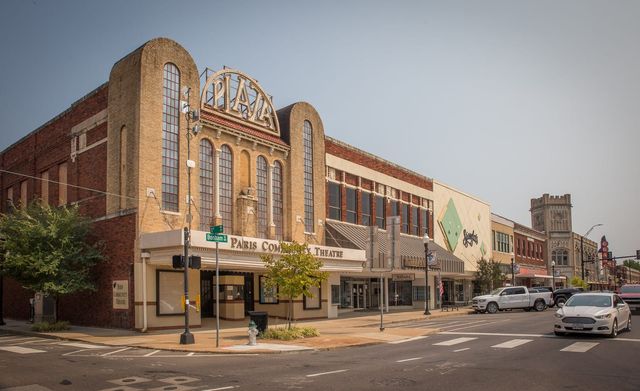 The historic Plaza Theater and storefronts on the downtown square in Paris, Texas