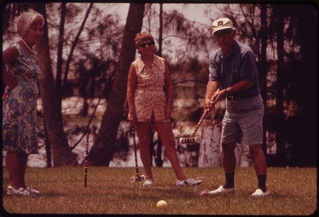 Residents playing croquet at a retirement community