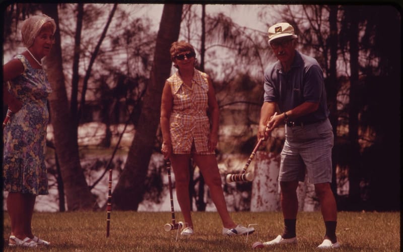Residents playing croquet at a retirement community