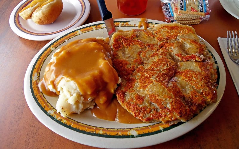 Chicken fried steak topped with cream gravy