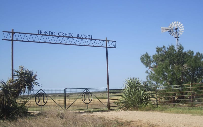 A metal ranch entrance gate on a Texas ranch