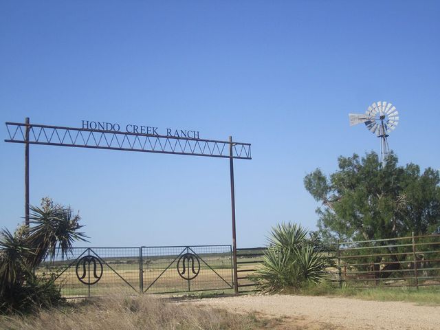A metal ranch entrance gate on a Texas ranch