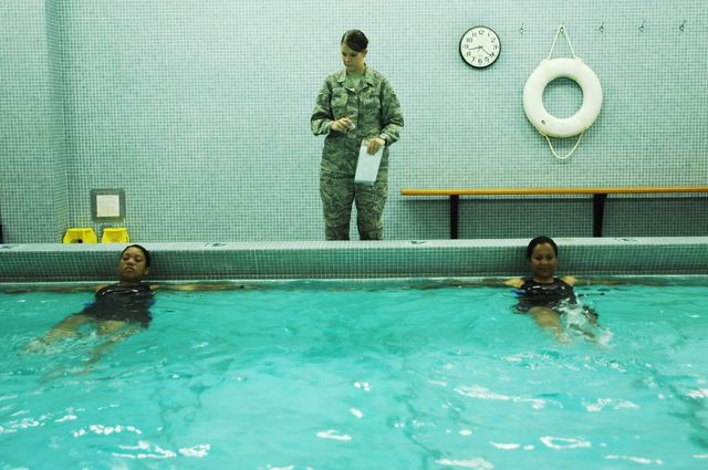 A physical therapist guiding a patient through a rehabilitation exercise